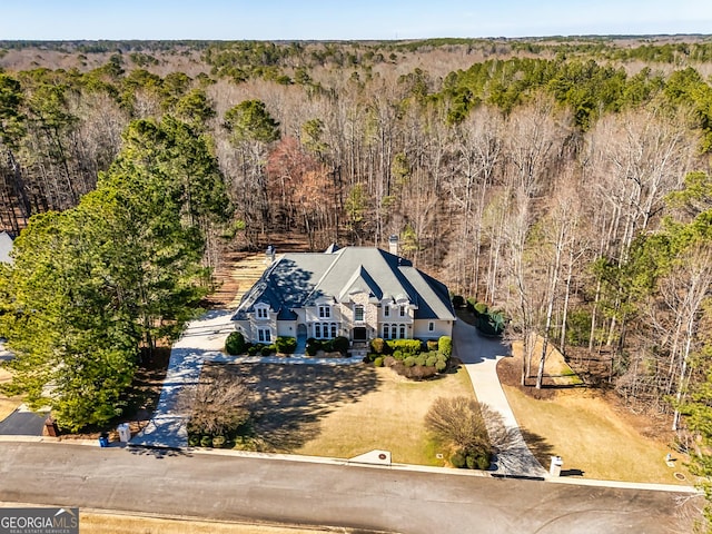 drone / aerial view featuring a view of trees