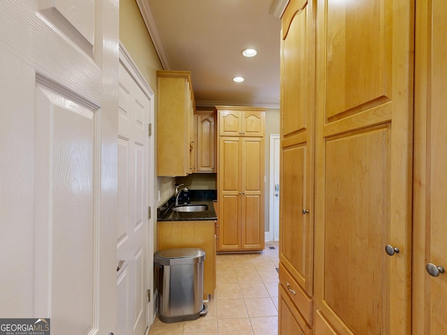 corridor with crown molding, recessed lighting, light tile patterned flooring, and a sink