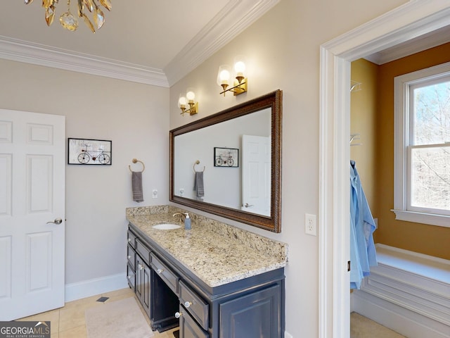 bathroom with tile patterned floors, baseboards, ornamental molding, and vanity