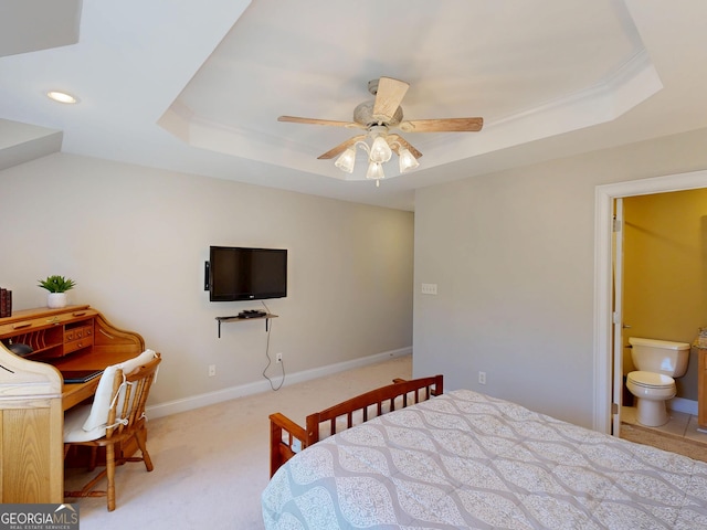 bedroom with a tray ceiling, light carpet, baseboards, and recessed lighting