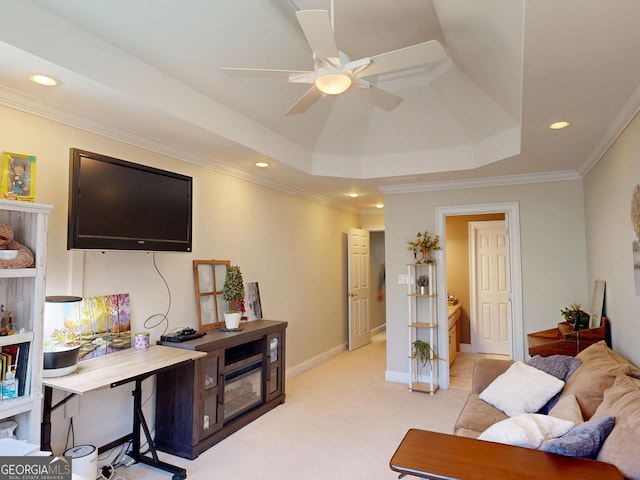 living area with a tray ceiling, light colored carpet, crown molding, and recessed lighting