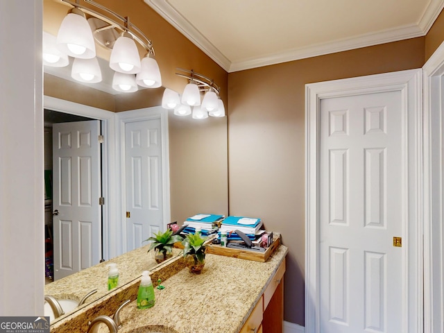 bathroom with ornamental molding and vanity