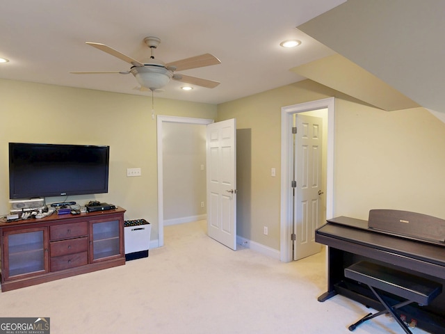 interior space featuring light carpet, baseboards, a ceiling fan, and recessed lighting