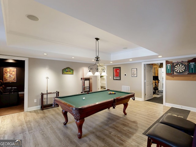 playroom with crown molding, recessed lighting, a raised ceiling, visible vents, and baseboards