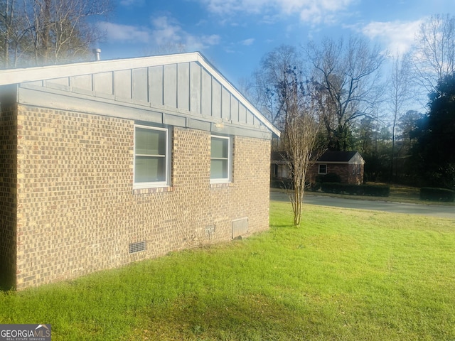 view of property exterior featuring a lawn