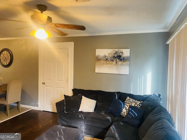 living room with hardwood / wood-style flooring, ornamental molding, and ceiling fan