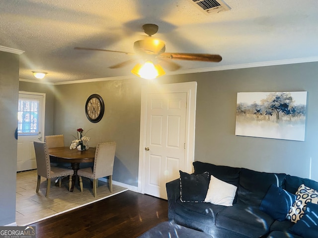 living room featuring wood-type flooring and ornamental molding