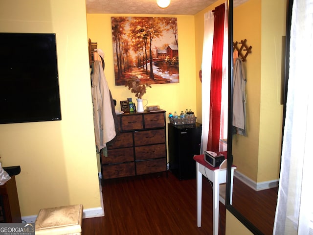 hallway featuring dark hardwood / wood-style flooring