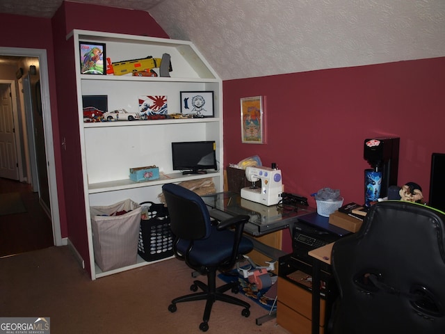 office area with vaulted ceiling, carpet, and a textured ceiling