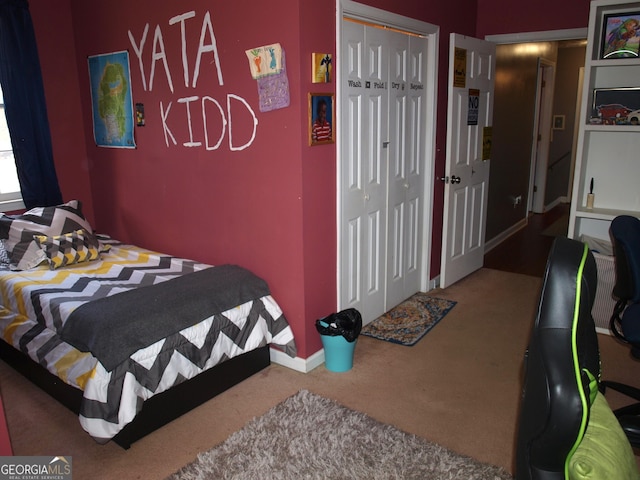 carpeted bedroom featuring a closet