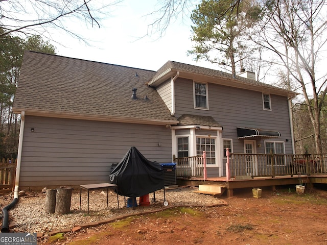 back of property with a deck