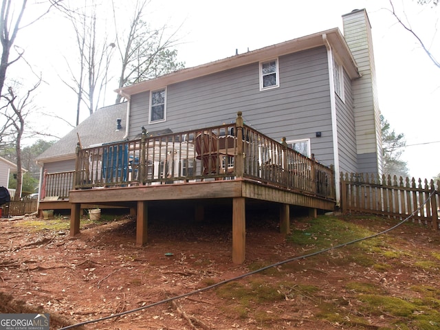 back of house featuring a wooden deck