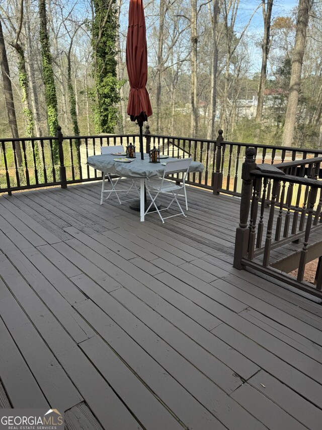 3738 Windy Hill Dr SE, Conyers, GA 30013 - wooden terrace with outdoor dining area