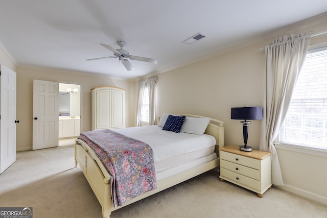 carpeted bedroom featuring multiple windows, ornamental molding, and ceiling fan