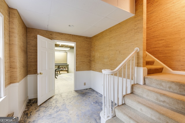 stairs with concrete floors