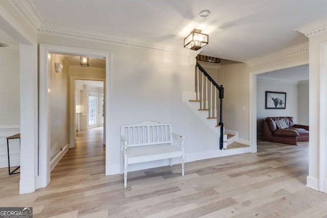 interior space with hardwood / wood-style flooring and crown molding