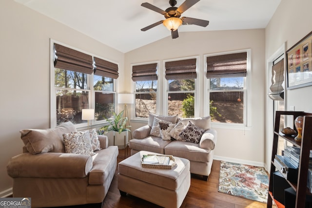 interior space featuring ceiling fan, lofted ceiling, and dark wood-type flooring