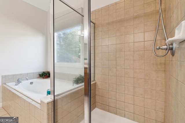 bathroom with separate shower and tub