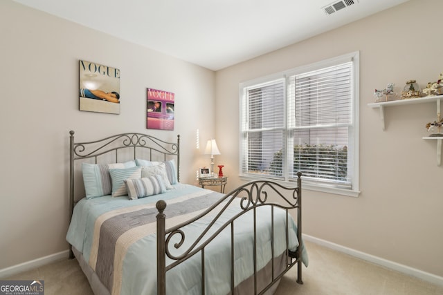 bedroom featuring light colored carpet