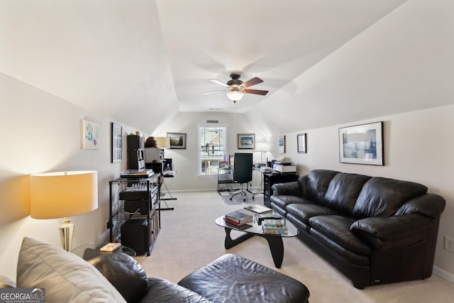 carpeted living room featuring vaulted ceiling and ceiling fan