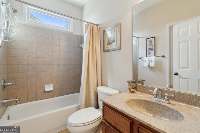 full bathroom featuring toilet, vanity, and shower / bathtub combination with curtain