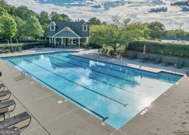 view of pool featuring a patio