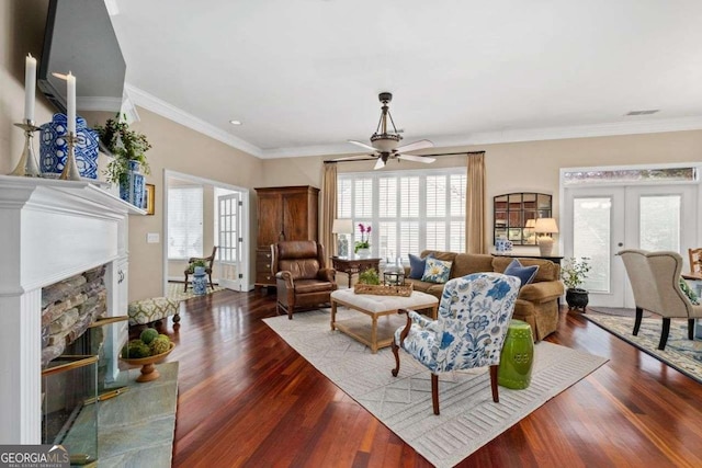 living room featuring ornamental molding, dark wood-type flooring, ceiling fan, and french doors