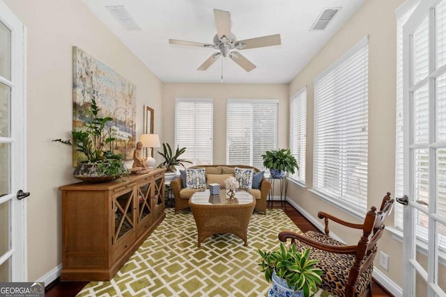 sunroom / solarium with a wealth of natural light and french doors