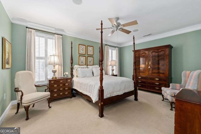 bedroom with crown molding, light carpet, and ceiling fan