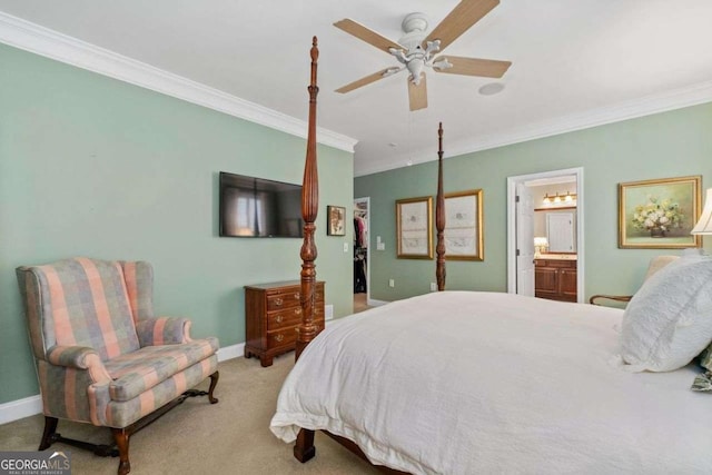 bedroom with crown molding, light colored carpet, ceiling fan, and ensuite bath