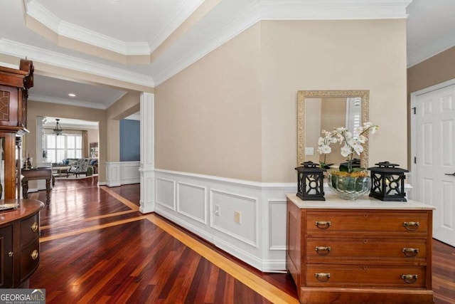 hallway with dark hardwood / wood-style flooring and ornamental molding