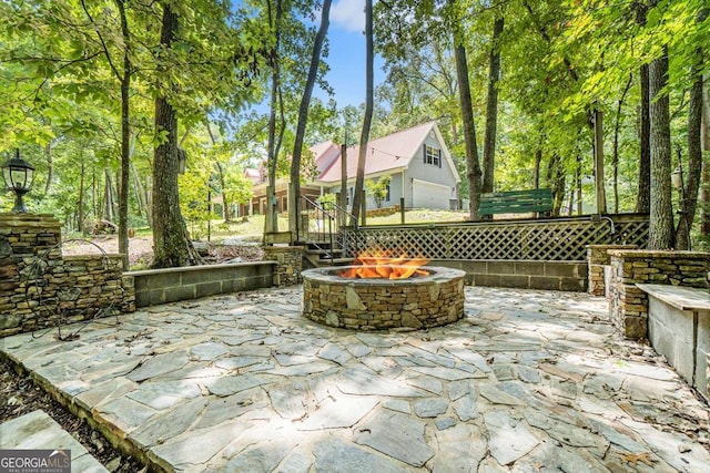 view of patio with a fire pit