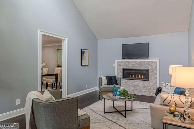 3847 Admiral Dr, Chamblee, GA 30341 - living room with a glass covered fireplace, wood finished floors, and high vaulted ceiling