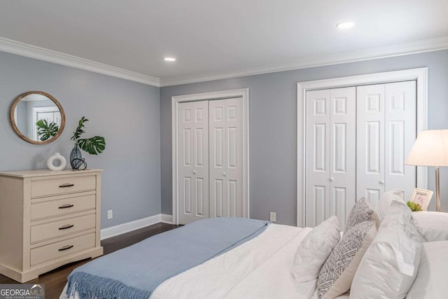 3847 Admiral Dr, Chamblee, GA 30341 - bedroom featuring multiple closets, dark wood-type flooring, ornamental molding, and recessed lighting