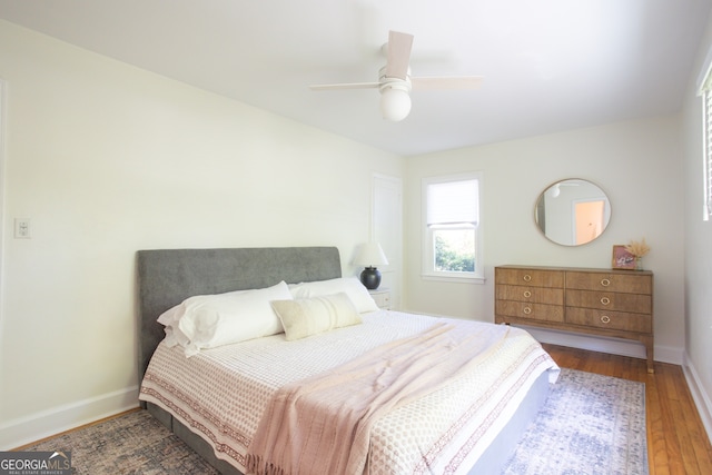 bedroom featuring hardwood / wood-style flooring and ceiling fan