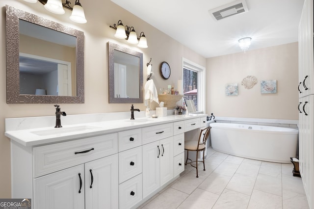 bathroom with vanity and a bathtub