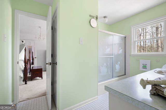 bathroom featuring an enclosed shower, vanity, and tile patterned flooring