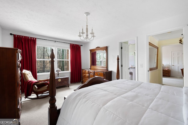 carpeted bedroom with a chandelier and a textured ceiling