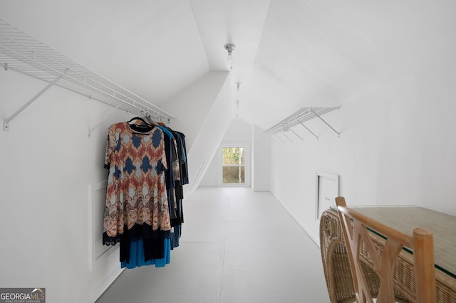 spacious closet with vaulted ceiling