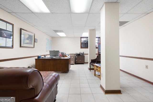 tiled home office with a paneled ceiling