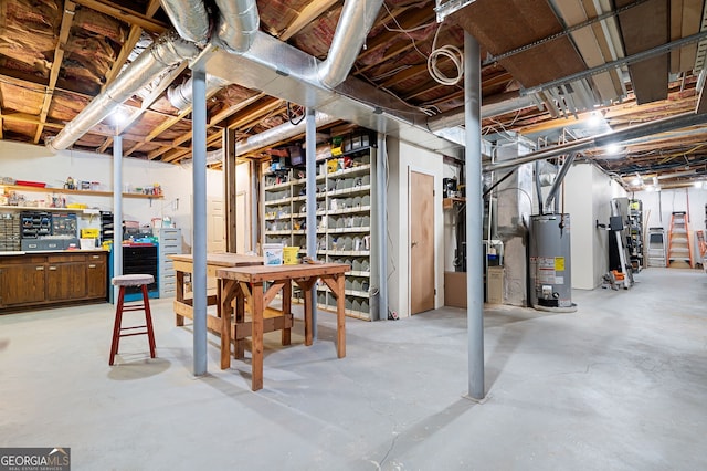 basement featuring water heater and a workshop area