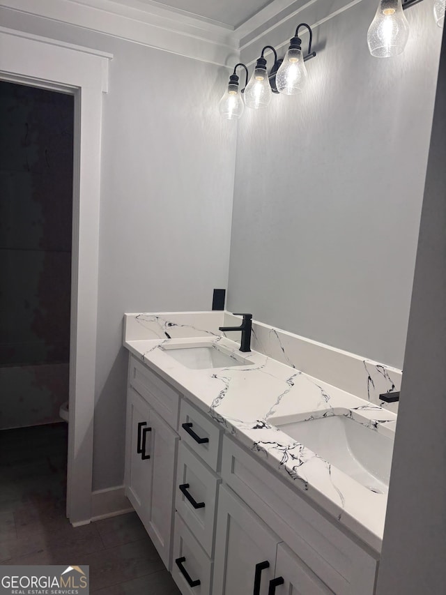 bathroom with vanity and hardwood / wood-style floors