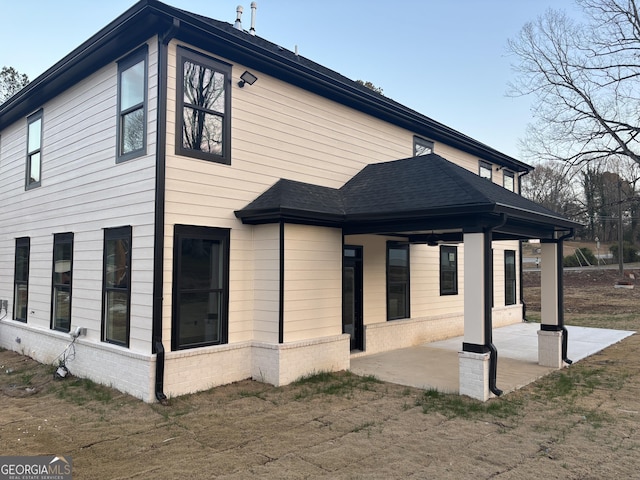 view of side of property with a patio