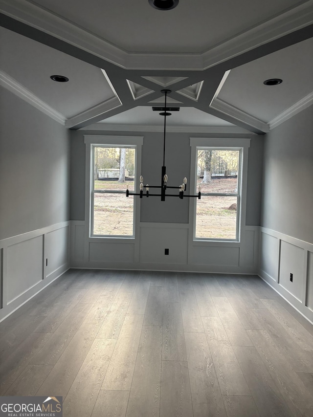 spare room featuring ornamental molding and wood-type flooring