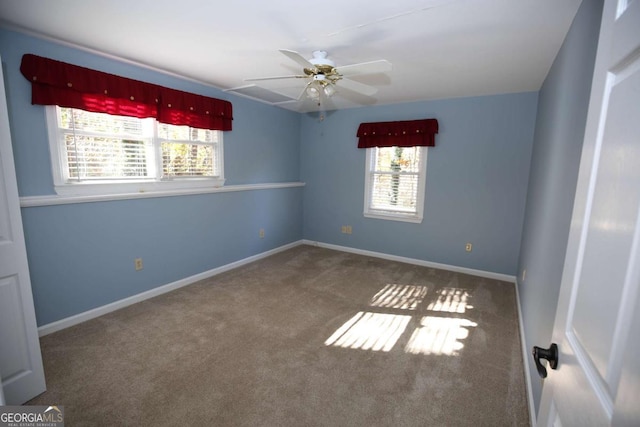 unfurnished room featuring ceiling fan, carpet flooring, and a wealth of natural light