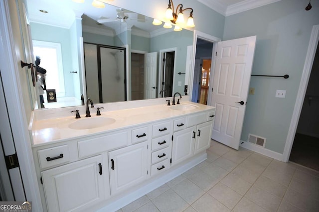 bathroom with crown molding, a shower with door, ceiling fan, tile patterned flooring, and vanity