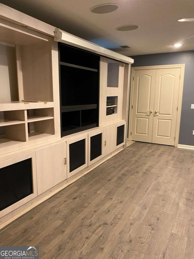 unfurnished living room featuring hardwood / wood-style floors