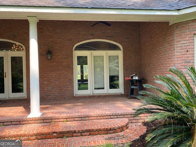 doorway to property featuring ceiling fan and a patio area