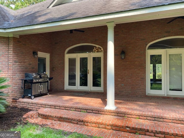 view of exterior entry featuring a patio