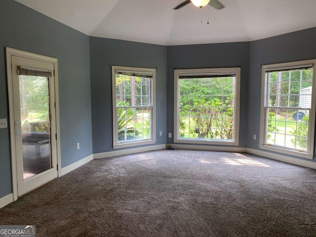 unfurnished room featuring ceiling fan, lofted ceiling, and carpet